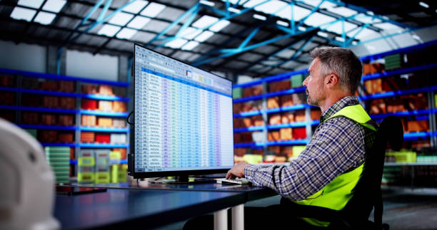 Warehouse person on a desktop computer