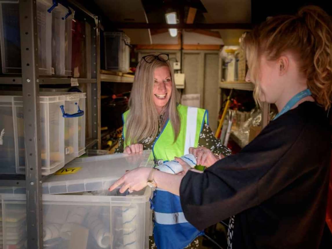 Two ladies checking stock