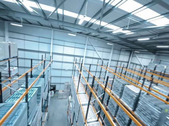 Drone shot inside a warehouse racking